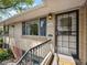 Close-up of the front entrance with a storm door, house number, and exterior lighting at 746 Birch St, Denver, CO 80220