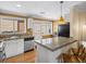 Bright kitchen with stainless steel appliances, granite countertops, and breakfast bar seating at 746 Birch St, Denver, CO 80220