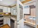 Kitchen with stainless appliances and convenient access to outdoor balcony at 746 Birch St, Denver, CO 80220
