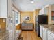 Sunlit kitchen boasting stainless appliances, granite counters, and ample cabinet space at 746 Birch St, Denver, CO 80220