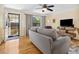 Cozy living room with hardwood floors, gray sofa, and a large window at 746 Birch St, Denver, CO 80220