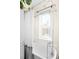 Bright bathroom features a clawfoot tub, chrome shower fixtures, and a large window for natural light at 4718 W 34Th Ave, Denver, CO 80212