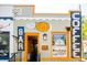 Exterior of Cafe Zuri, a coffee shop featuring creative sign designs and outdoor seating at 4718 W 34Th Ave, Denver, CO 80212