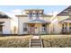 Charming two-story home with a front porch, showcasing its classic architectural style and curb appeal at 4718 W 34Th Ave, Denver, CO 80212