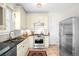 Bright kitchen with stainless steel appliances, tile floors and decor at 4718 W 34Th Ave, Denver, CO 80212
