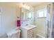 A full bathroom with a tub, shower, and vanity with storage at 2902 S Meade St, Denver, CO 80236