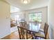 The dining room features hardwood floors and a large window overlooking the backyard at 2902 S Meade St, Denver, CO 80236