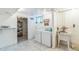 A clean laundry area with a washer, dryer, and sink at 2902 S Meade St, Denver, CO 80236