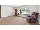 Cozy living room featuring a large window and comfortable seating arrangement at 2902 S Meade St, Denver, CO 80236