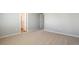 Spacious bedroom featuring neutral carpet, a large window and fresh paint at 48195 Shetland Dr, Bennett, CO 80102