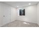 Bright basement bedroom with carpet, window, and door at 8035 Garrison Ct # A, Arvada, CO 80005