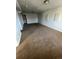 Large finished basement area with carpeted floor and neutral paint at 1245 Yates St, Denver, CO 80204