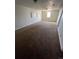 Basement area with a carpeted floor and neutral paint at 1245 Yates St, Denver, CO 80204
