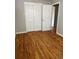 Bedroom with hardwood floors, closet, neutral paint and natural light at 1245 Yates St, Denver, CO 80204