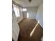 Bedroom with a carpeted floor, good natural lighting, and a closet at 1245 Yates St, Denver, CO 80204