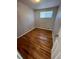 Bedroom with hardwood floors, neutral paint and natural light at 1245 Yates St, Denver, CO 80204