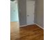 Bright living room featuring hardwood floors and a fresh, neutral paint scheme at 1245 Yates St, Denver, CO 80204
