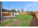 Backyard features a covered patio with concrete and rock landscaping at 5491 Lowell Blvd, Denver, CO 80221