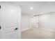 Finished basement showcasing a connecting hallway and neutral walls at 5491 Lowell Blvd, Denver, CO 80221