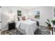 Bright bedroom featuring natural light from two windows and stylish décor at 5491 Lowell Blvd, Denver, CO 80221