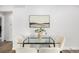Stylish dining area featuring a glass table and modern chairs, illuminated by natural light at 5491 Lowell Blvd, Denver, CO 80221