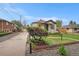 Cozy home featuring charming exterior, driveway, and well-maintained front yard at 5491 Lowell Blvd, Denver, CO 80221