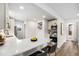 Bright kitchen features updated appliances, quartz countertops, and neutral backsplash at 5491 Lowell Blvd, Denver, CO 80221