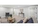 Bright living room showcases neutral paint, carpet, and modern furniture at 5491 Lowell Blvd, Denver, CO 80221