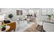 Open-concept living space with stylish furniture and seamless flow to kitchen at 5491 Lowell Blvd, Denver, CO 80221