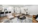 Contemporary living area featuring open layout, modern furnishings, and eat in kitchen at 5491 Lowell Blvd, Denver, CO 80221