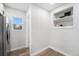 Pantry with a window, built in shelving and plank flooring at 5491 Lowell Blvd, Denver, CO 80221