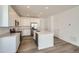 Modern kitchen with stainless steel appliances and a center island at 708 N Bently St, Watkins, CO 80137