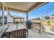 Relaxing back porch features a dining table with a grill, perfect for outdoor entertaining at 1159 Sunrise Dr, Erie, CO 80516