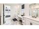 Bright bathroom features double sinks, sleek hardware, and a glass-enclosed shower at 1159 Sunrise Dr, Erie, CO 80516