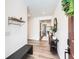 Inviting entryway with wood floors, convenient bench, stylish accents, and ample natural light at 1159 Sunrise Dr, Erie, CO 80516