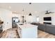 Bright kitchen with stainless steel appliances, a center island and an open floor plan at 1159 Sunrise Dr, Erie, CO 80516