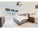 Serene bedroom featuring neutral tones, natural light, and a comfortable bed at 1159 Sunrise Dr, Erie, CO 80516
