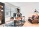 Bright home office featuring a large desk, comfortable leather chair, and ample storage at 1159 Sunrise Dr, Erie, CO 80516