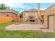 Large brick paver patio, perfect for outdoor entertaining, adjacent to a deck and grassy yard at 3050 Bellaire St, Denver, CO 80207