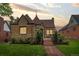 Charming stone home with a manicured lawn and inviting front porch at 3050 Bellaire St, Denver, CO 80207