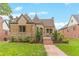 Cute stone home with a landscaped yard and walkway at 3050 Bellaire St, Denver, CO 80207