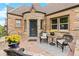 Cozy patio with wicker furniture, perfect for relaxing at 3050 Bellaire St, Denver, CO 80207