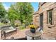 Relaxing patio area with wicker furniture and flowers at 3050 Bellaire St, Denver, CO 80207