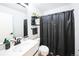 This bathroom has a floating shelf above the toilet, and a neutral color palette at 9267 Welby Rd Ter, Denver, CO 80229