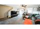 Cozy living room with plush carpeting, neutral tones, and ample natural light at 9267 Welby Rd Ter, Denver, CO 80229