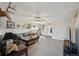 Spacious living room featuring neutral walls, soft carpet, and a ceiling fan at 9267 Welby Rd Ter, Denver, CO 80229