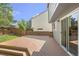 Spacious backyard deck with stairs to the grassy lawn and privacy fence at 4857 Tarcoola Ln, Highlands Ranch, CO 80130
