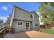 Two-story house features a large deck with a sliding glass door at 4857 Tarcoola Ln, Highlands Ranch, CO 80130