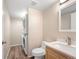 Bathroom features a stackable washer and dryer, vanity, and neutral wall color at 4857 Tarcoola Ln, Highlands Ranch, CO 80130