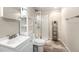 Modern bathroom with glass-enclosed shower, and shelving at 4857 Tarcoola Ln, Highlands Ranch, CO 80130